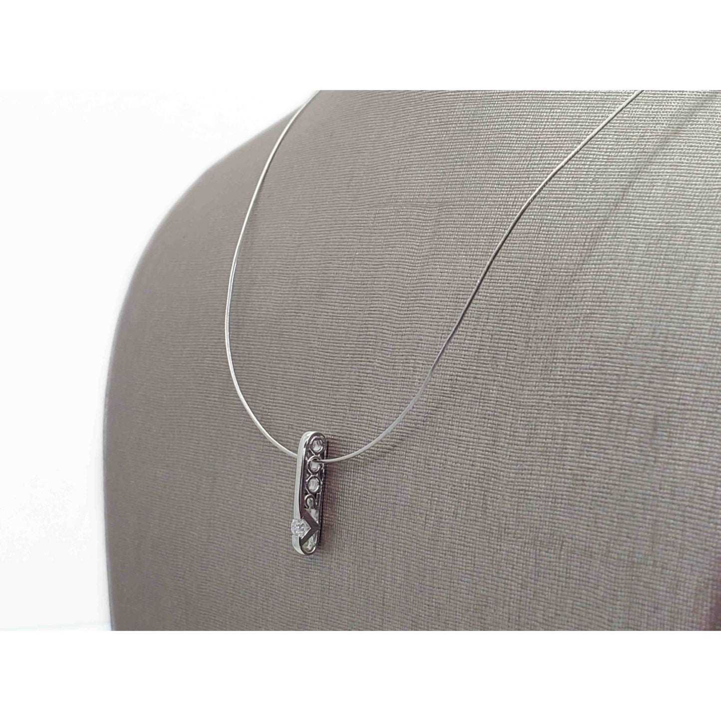 0.1 ctw Diamond V2000 Platinum Charm Pendant on 18k White Gold Chain