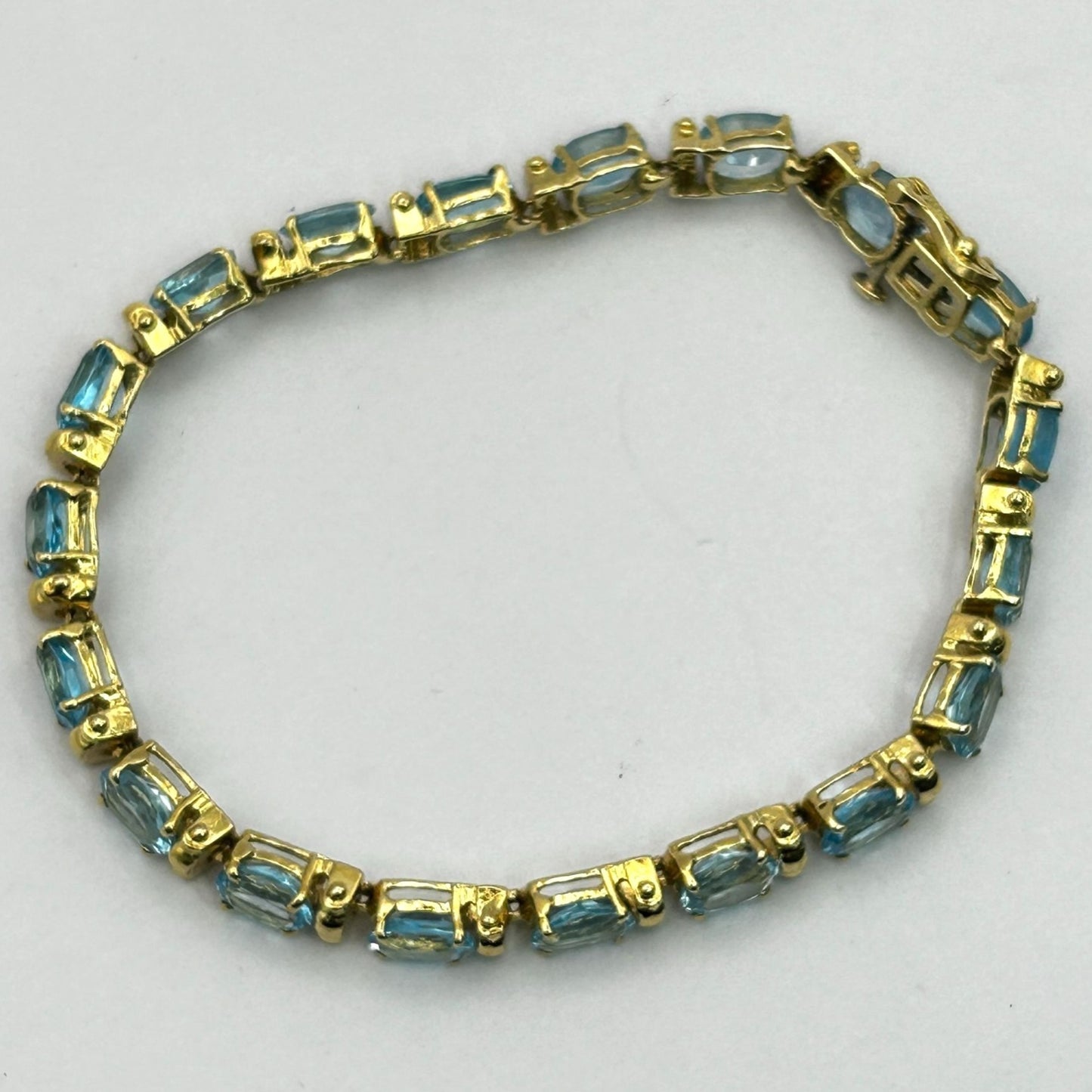 Blue Topaz Gemstone 14k Gold 7.5" Tennis Bracelet - 19 Stones