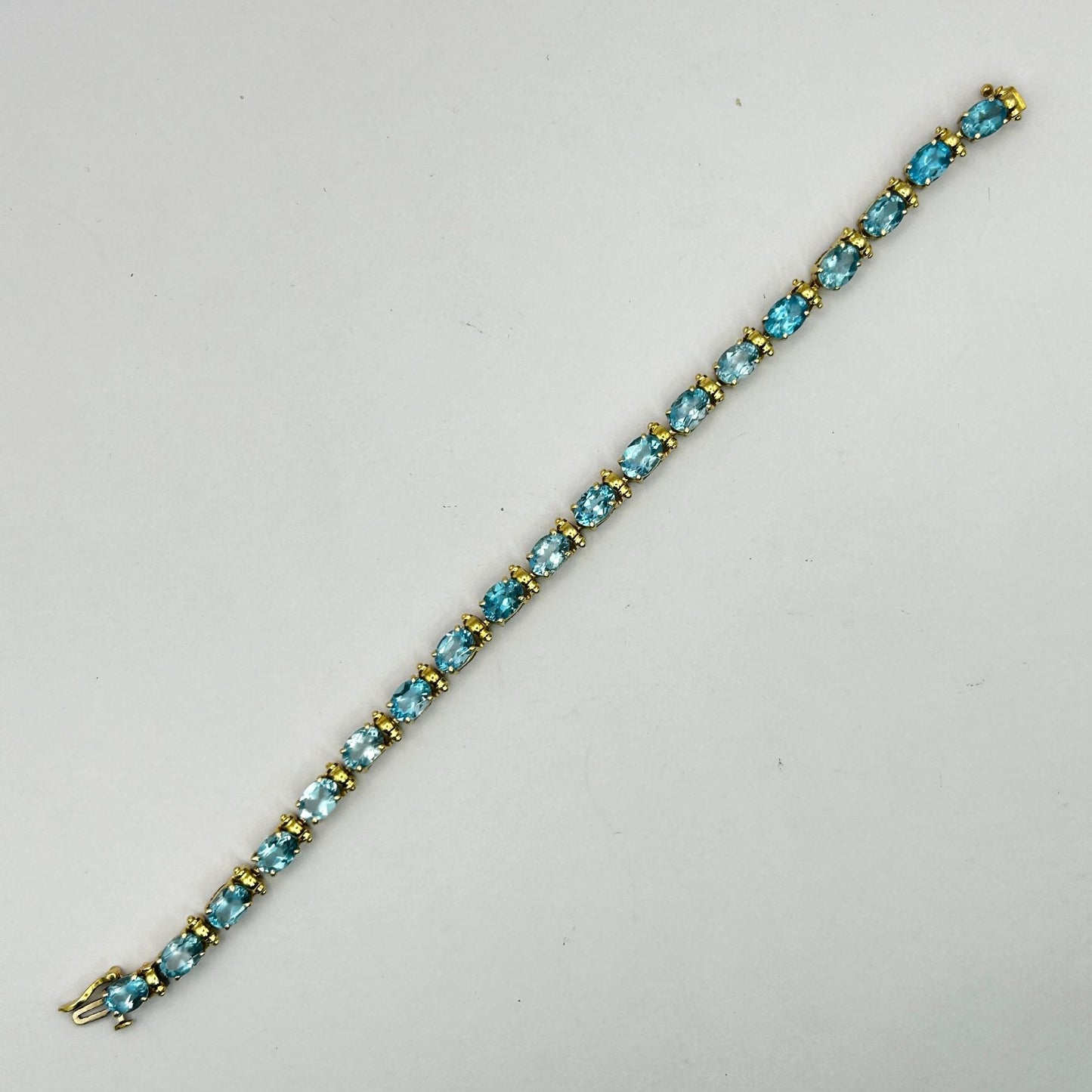 Blue Topaz Gemstone 14k Gold 7.5" Tennis Bracelet - 19 Stones