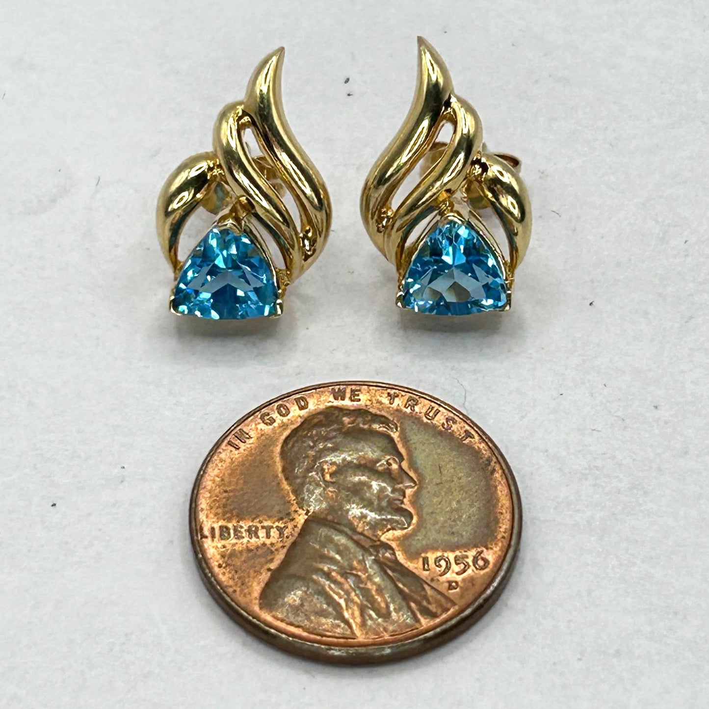 6.8mm Trillion Cut Blue Topaz 14k Yellow Gold Swirl Stud Earrings